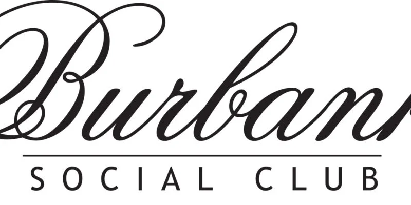 Burbank Social Club members smiling at a print event